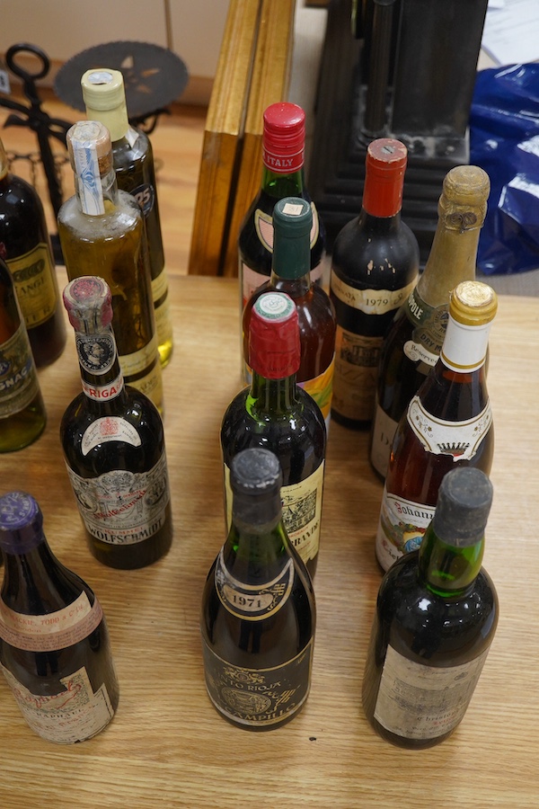 Twenty bottles of spirits, liqueurs and wine, together with some half bottles and miniatures, including; a 1947 Heidsieck & Co. Dry Monopole champagne, a 1983 Chateau Ferrande Bordeaux, two bottles of Herbes Mesclades, a